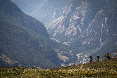 MTB riders Ludo May and Yann Guigoz ride a trail above the Vispa valley, Switzerland on June 26, 2018.