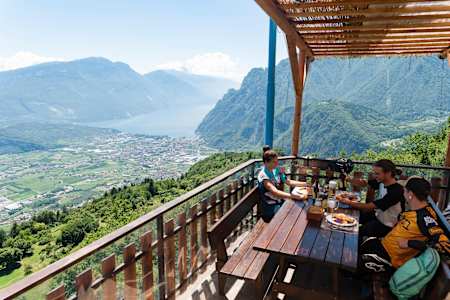 Eleonara Farina, Mirco Montagni and Marco Giacomello enjoy the view at Lake Garda, Italy on June 15, 2018.