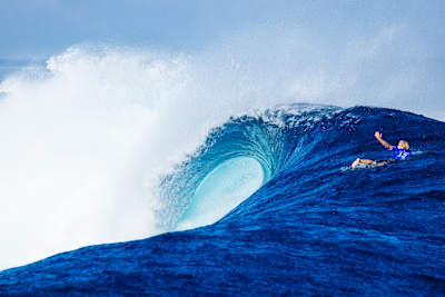 John John Florence paddling out at Cloudbreak in Fiji