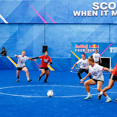 In the 2024 Red Bull Four 2 Score World Final in Leipzig, Germany, players from Team USA and Team Canada fiercely compete in an indoor soccer match
