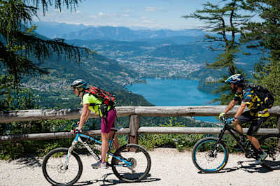 MTB riders Martina Pattanaro and Eugenio Carugati riding in Alpe Cimbra, Italy on June 26, 2018.