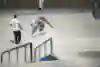 TJ Rogers performs a nollie backside 180 over the rail