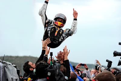 Marc Márquez celebrates after winning at the Moto Grand Prix 2012 at the Circuit de la Comunitat Valenciana in Valencia, Spain on November 11, 2012