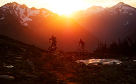 Moutain bikers Sam Poarch and Bruno Long riding in Revelstoke, BC, Canada