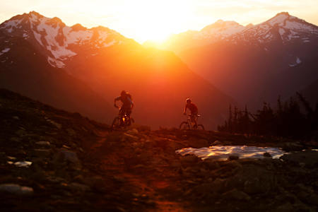 Moutain bikers Sam Poarch and Bruno Long riding in Revelstoke, BC, Canada