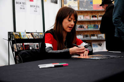 Yazz Ahmed signing merch on tour