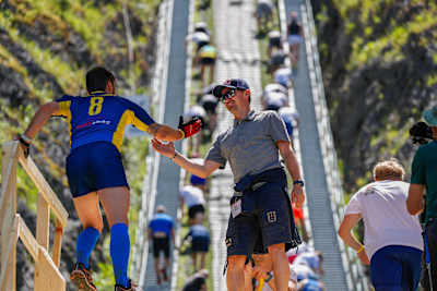 Former ski jumper Adam Malysz of Poland greets participants during qualification run on the 400 metre name ski-jump during the Red Bull 400 at Zakopane, Poland on June 29, 2019.