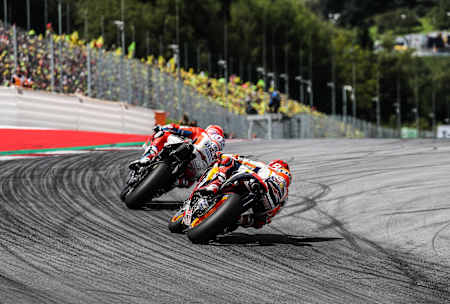 A photo of Andrea Dovizioso and Marc Márquez tackling a corner at Red Bull Ring during the 2017 MotoGP of Austria.