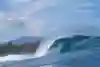 An empty wave barrels across the reef at Pipeline in Hawaii.