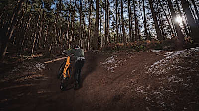 Alan Milway pushing MTB up hill