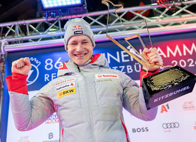 Race winner Marco Odermatt holds up his trophy during the award ceremony for the men's Super-G at the 89th Hahnenkamm Races of the FIS Alpine Ski World Cup in Kitzbühel, Austria.