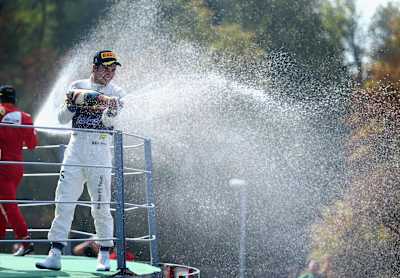 An image of Sergio ‘Checo’ Pérez celebrating an F1 podium finish.