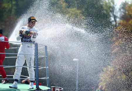 An image of Sergio ‘Checo’ Pérez celebrating an F1 podium finish.