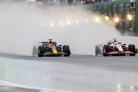 Max Verstappen of Red Bull Racing and The Netherlands overtakes Mick Schumacher of Germany and Haas during the F1 Grand Prix of Japan at Suzuka International Racing Course on October 09, 2022.