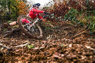 Mountain biker crashes on muddy trails.