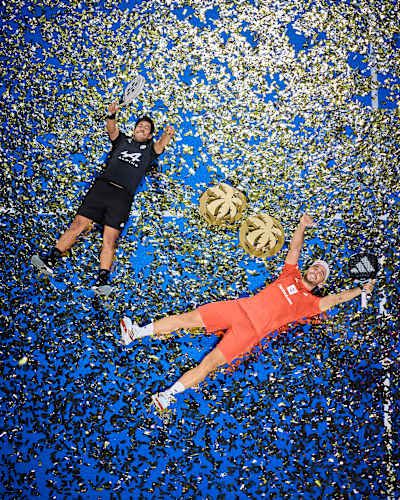 Federico Chingotto and Alejandro Galán revel in victory at the Motorola Razr Miami Premier Padel P1 in March 2025, surrounded by glittering confetti and their trophies.