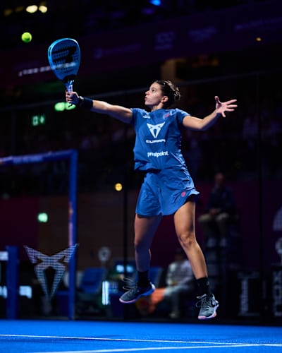 Delfina Brea Senesi in dynamic action at the 2025 CUPRA Premier Padel P2 finals in Dusseldorf, Germany, showcasing elite talent on the iconic blue court