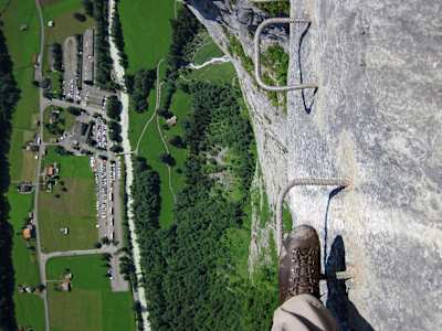 Crossing the cliffs between Mürren and Gimmelwald on a via ferrata in Switzerland.