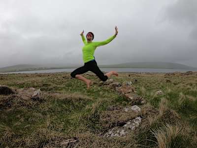 Anna McNuff jumps while on her barefoot Ultrarunning around Great Britain attempt in 2019.
