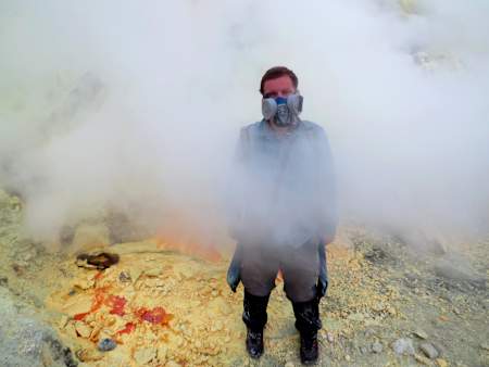 Grzegorz Gawlik stands on a volcano in Indonesia.