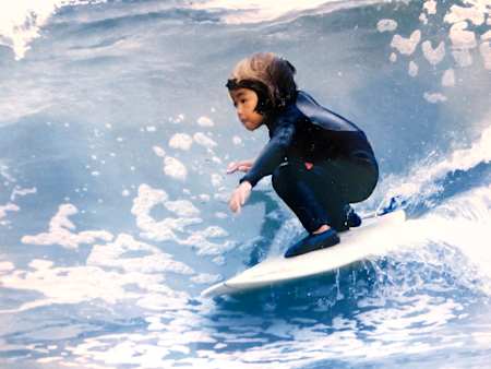 A photograph of a five-year-old Kanoa Igarashi surfing.