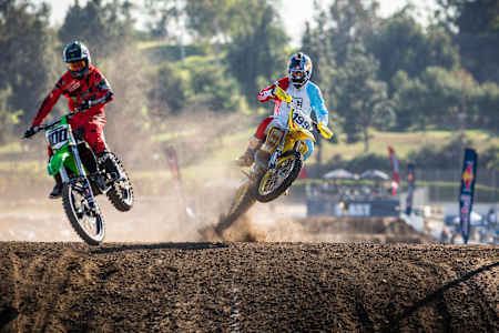 A photo of Josh Hansen (left) and Travis Pastrana (right) competing at Red Bull Straight Rhythm 2014 at Fairplex in Pomona, California.