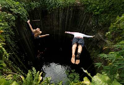 Orlando Duque and Jonathan Paredes jump into the Cenote Ik Kil in Mérida, Yucatán, Mexico on December 2, 2020.