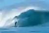 Surfer Landon McNamara pulls into the tube at Pipeline