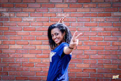 Pro Tekken gamer Cuddle Core poses for a portrait at home.