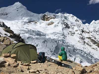 Ana Salvador sits with Splitboard in Cordillera Blanca, Peru.