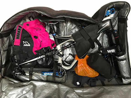 A mountain bike and spares packed and strapped into a special bike bag used to travel with.