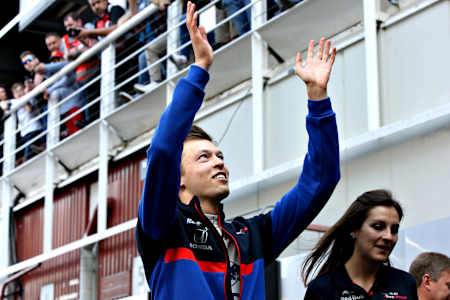 Daniil Kvyat looks happy to be back on the grid