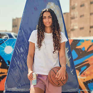 Nadine Selaawi gears up for a basketball challenge with Hisham El Khateeb in Cairo, Egypt. 