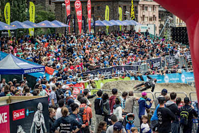 A rider enters the finish area of the Vallnord DH World Cup