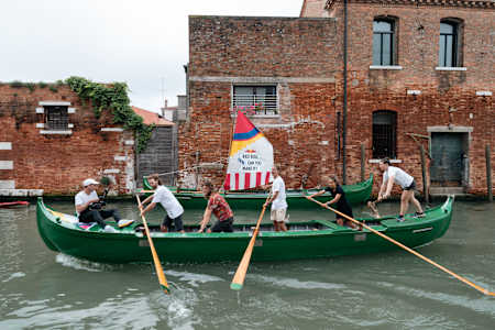 A Red Bull Can You Make It? team tries to row a gondola at a Checkpoint Challenge in Venice, Italy on May 22, 2024.
