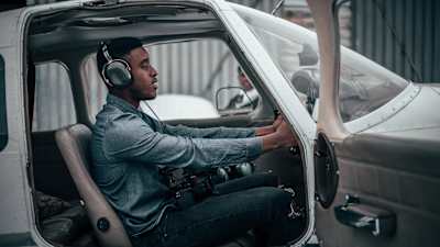 A student of the iFly Academy, South Africa's first black-owned flight school, in the cockpit of light aircraft.