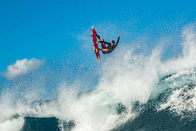 Ian Walsh performs an aerial surfing at home in Maui