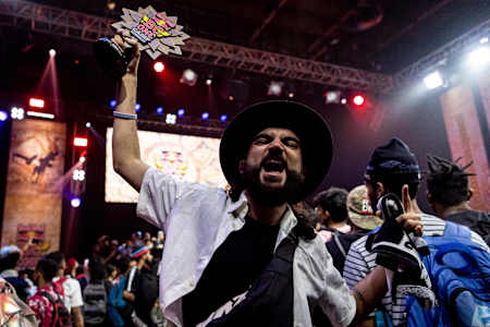 Raw Shan holds the trophy.