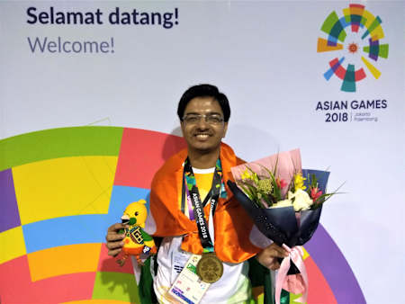 Tirth Mehta with his 2018 Asian Games bronze medal in Hearthstone.