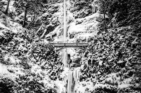 Frozen Multnomah Falls over the Columbia River in Oregon.