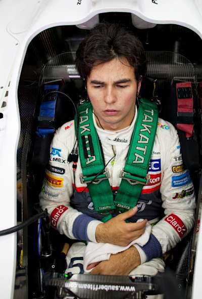 An image of Sergio Pérez sat in his Sauber F1 Team car.