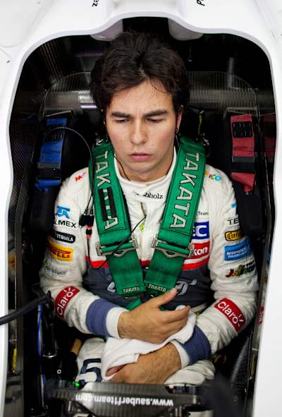 An image of Sergio Pérez sat in his Sauber F1 Team car.