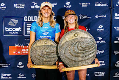 Caity Simmers and Molly Picklum with their Gold Coast pro trophies.