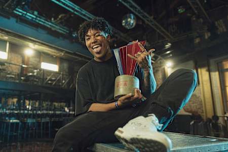 The crown poses with the trophy of Red Bull Dance Your Style USA.