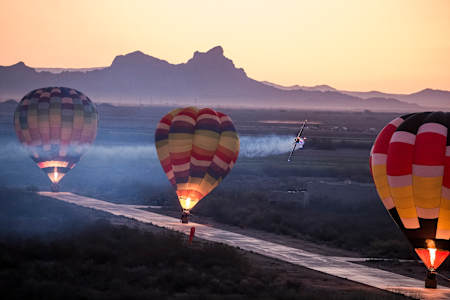 Kirby Chambliss performs with hot air balloons in Eloy, AZ