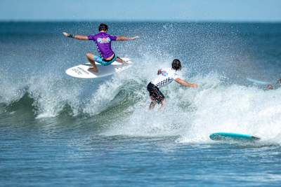 Participants surf at Red Bull Foam Wreckers 2021 at Cocoa Beach, Florida