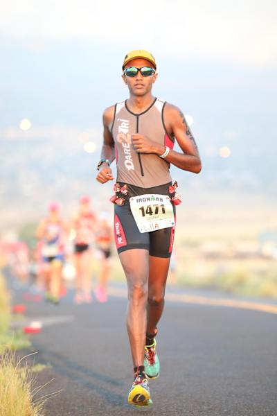 Deepak Raj runs as part of an Ironman race