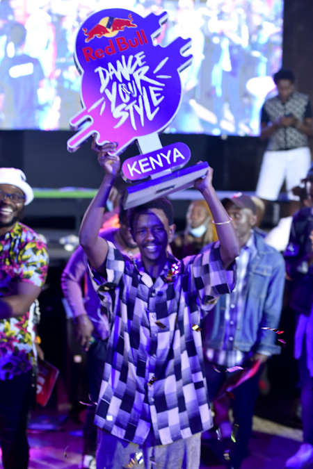 Ian Tico holding the Red Bull Dance Your Style trophy in Nairobi, Kenya.