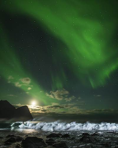 Mick Fanning surfing at midnight in Norway.