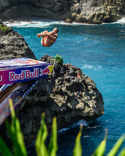 Rhiannan Iffland of Australia launches from the 22-metre platform at Broken Beach during the 2026 Red Bull Cliff Diving World Series in Bali, Indonesia, on 23 May 2026